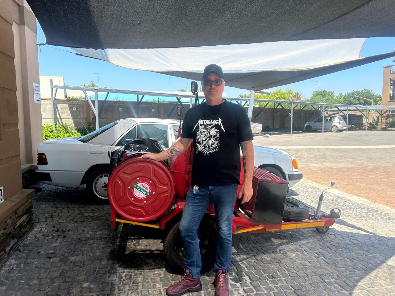 Tony with the red drain-jetting hose reel and trailer